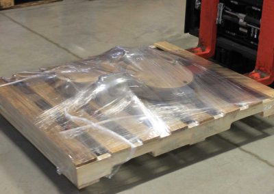 Valves and accessories stretch wrapped to a pallet using the TAB Wrapper Tornado orbital wrapper, set on a forklift